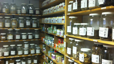 Image of shelves with jars of tea and supplements